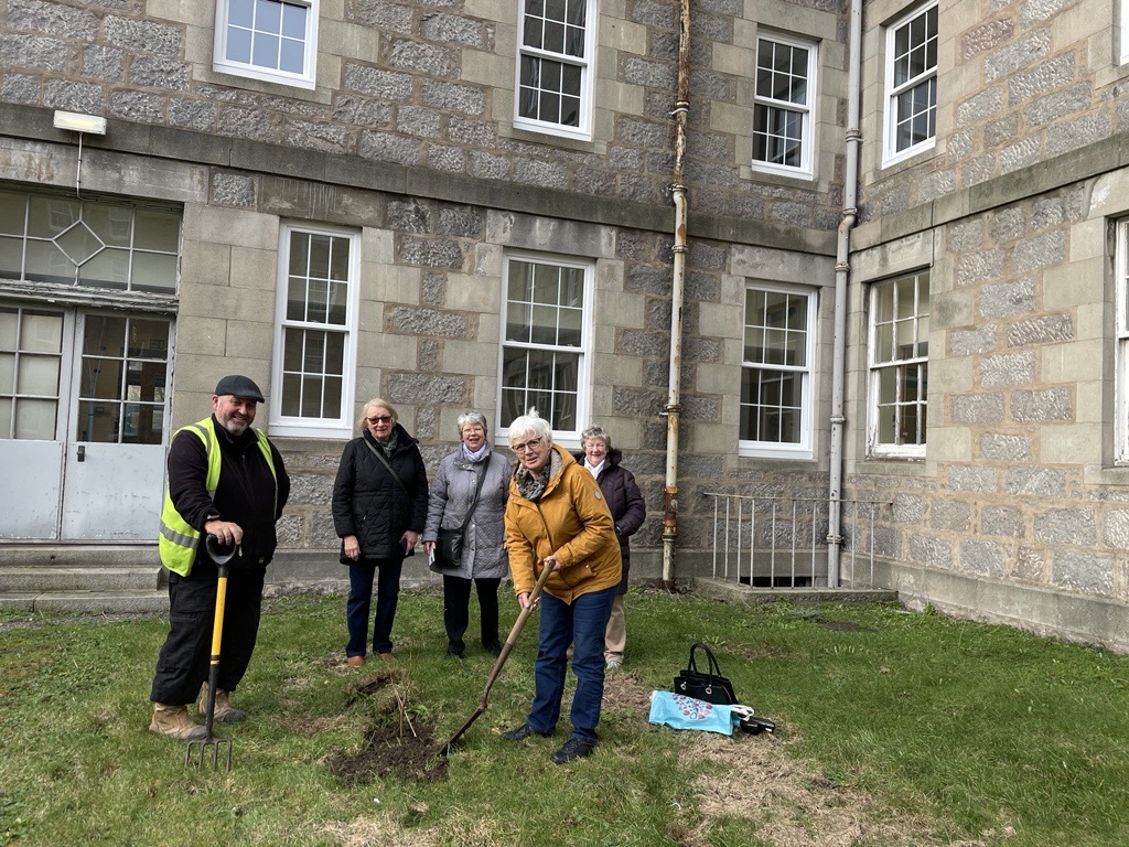 Loreen, Joyce, Myra and Alice from the NHS Retirement Fellowship (NHSRF) were joined by groundsman Bob Christie and environmental manager Rachel Roberts outside Ashgrove House at Foresterhill Health Campus recently to plant three tree saplings.